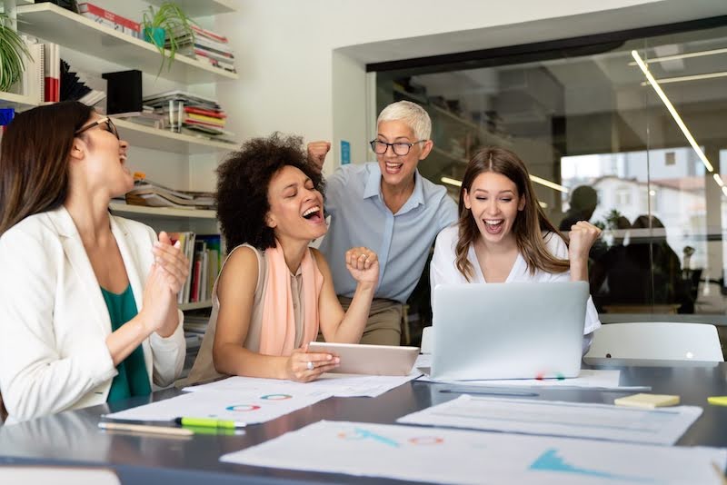 a group of project managers have fun at a meeting