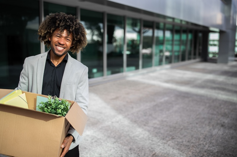 a man carries a box for his seasonal job