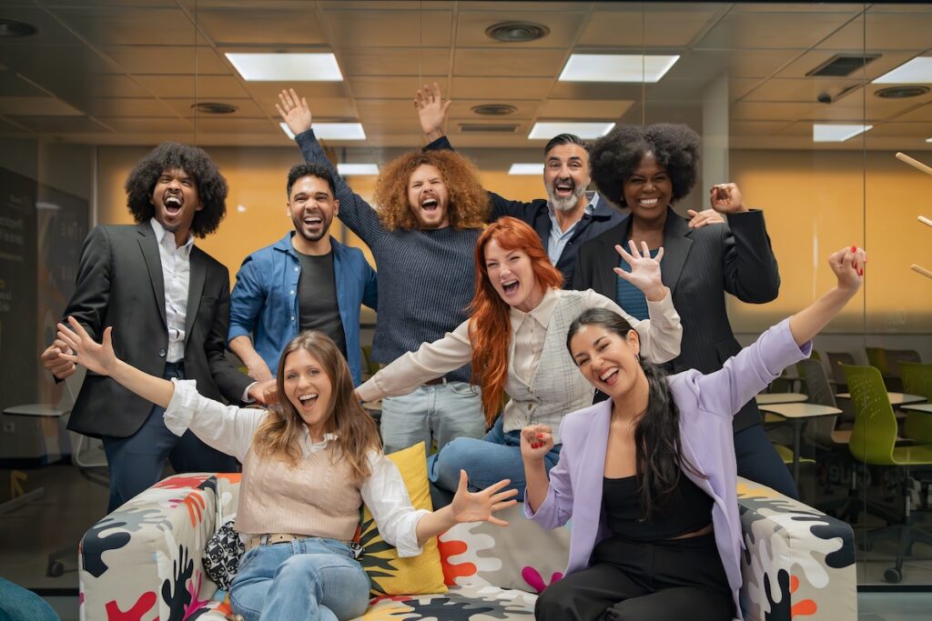 Diverse office team shows a positive culture that makes job listings near Dallas stand out.